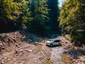 suv car mountains creek on background Royalty Free Stock Photo