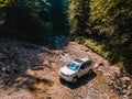 suv car mountains creek on background Royalty Free Stock Photo