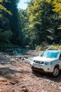 suv car mountains creek on background Royalty Free Stock Photo