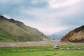 SUV Car On Off Road In Summer Mountains Landscape. Active Lifest
