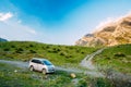 SUV Car On Off Road In Summer Mountains Landscape. Active Lifestyle