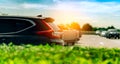 SUV Car parked on concrete parking area at factory near the sea with blue sky and clouds. Car dealership. Car stock for sale. Car Royalty Free Stock Photo