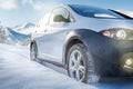 SUV car on snow covered mountain road Royalty Free Stock Photo