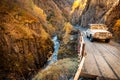 SUV into the Caucasus mountains on a mountain road Royalty Free Stock Photo