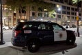 SUV cop vehicle parked on sidewalk