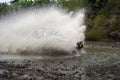 SUV crossing water at high speed Royalty Free Stock Photo