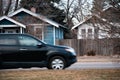 SUV driving through a small town