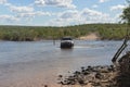 SUV or Four by Four crossing a river