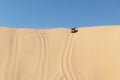 SUV going down a sand dune in the Namib desert Royalty Free Stock Photo