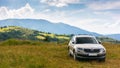 Suv on a hillside meadow Royalty Free Stock Photo