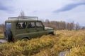 SUV in the marshes. The SUV drives through the swamps or marshes using a winch. Passable transport. Royalty Free Stock Photo