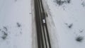 SUV movement on the highway in winter. view from above
