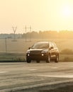 SUV moves on the country highway Royalty Free Stock Photo