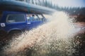 Suv offroad 4wd car rides through muddy puddle, off-road track road, with a big splash, during a jeeping competition Royalty Free Stock Photo