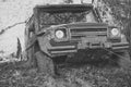 SUV is pulled out from puddle of mud by car winch. Royalty Free Stock Photo