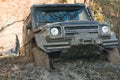 SUV is pulled out from puddle of mud by car winch. Royalty Free Stock Photo