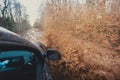 Suv 4wd car rides through muddy puddle, off-road track road, with a big splash, during a jeeping competition Royalty Free Stock Photo