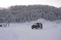 SUV in Winter Forest Snow Road Royalty Free Stock Photo