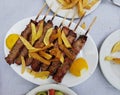 Suvlaki greek ethic food of meat top view potatoes on the table Royalty Free Stock Photo