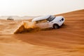 SUVs Trek Across the Desert Dunes Royalty Free Stock Photo