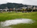 Rainy day at Suwa Lakeside Park with heavy clouds covering the mountains around Lake Suwako