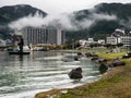 Rainy day at Suwa Lakeside Park with heavy clouds covering the mountains around Lake Suwako