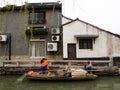 Water cleaning boat in one of the canals of Suzhou old town