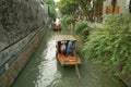 SUZHOU,CHINA-MAY 19, 2019-Traditional rowing boat taking tourists along the canal on Pingjianglu, Suzhou, China.Pingjiang road was