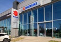 Suzuki cars dealership building entrance, with logo sign.