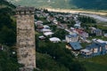 Svan towers in Mestia village with summer mountain. Roofs an buidings. Travel place Georgia. Copy space