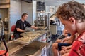 Svaneke, Bornholm island, Denmark - June 28, 2019. Bolcheriet - employee is producing hard candies.