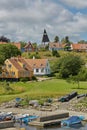 View of village of Svaneke in Denmark and modern three-legged water tower designed by Jorn Utzonon