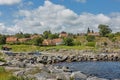 View of village of Svaneke in Denmark and modern three-legged water tower designed by Jorn Utzonon