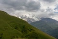 Svaneti - Panoramic view on Tetnuldi Peak covered with clouds, located in Greater Caucasus Mountain Range in Georgia. Royalty Free Stock Photo