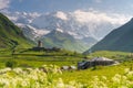 Svaneti watch tower in Ushguli village with Shkhara mountain in a morning, Caucasus mountain range, Georgia