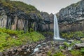 Svartifoss waterfall in skaftafell region on iceland. Beautiful waterfall viewed from far, a lot of water coming from vertical Royalty Free Stock Photo