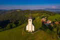 Sveti Andrej, Slovenia - Aerial drone view of Saint Andrew church Sv. Andrej at sunset in Skofja Loka area