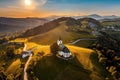 Sveti Andrej, Slovenia - Aerial drone view of Saint Andrew church Sv. Andrej at sunset in Skofja Loka area Royalty Free Stock Photo