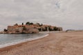 Sveti Stefan historical town island and paradise sand beach. Budva, Montenegro Royalty Free Stock Photo