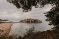 Sveti Stefan historical town island and paradise sand beach. Budva, Montenegro Royalty Free Stock Photo