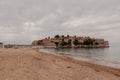 Sveti Stefan historical town island and paradise sand beach. Budva, Montenegro Royalty Free Stock Photo