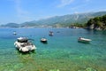 Boats for rent moored in Sveti Stefan Bay, Montenegro Royalty Free Stock Photo