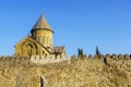 Svetitskhoveli Cathedral, Mtskheta, Georgia. The dome of the Cathedral above the battlements against the blue sky. Royalty Free Stock Photo