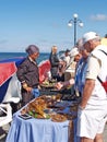 SVETLOGORSK, RUSSIA. The elderly woman considers an amber souvenir