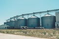 Svetlovodsk, Ukraine Ã¢â¬â 27 May, 2018: Modern Agricultural Silos against blue sky. Storage and drying of grains, wheat, corn, soy