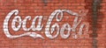 Svetlovodsk, Ukraine - 02.2021: Stylized Coca Cola lettering on a textured brick wall, editorial.