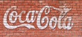 Svetlovodsk, Ukraine - 02.2021: Stylized Coca Cola lettering on a textured brick wall, editorial.