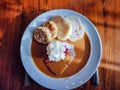 Svickova na smetane beef in sour cream sauce with whipped cream and cranberries served with knedlik bread dumpling