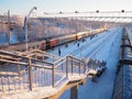 Svir, Russia,01.02.24: Svir railway station on the Oktyabrskaya railway. Passenger freight trains on rails. People and