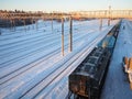 Svir, Russia,01.02.24: Svir railway station on the Oktyabrskaya railway. Passenger freight trains on rails. People and